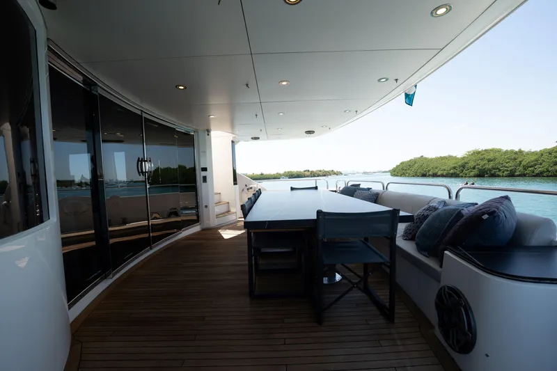 Slide: The Image of Luxurious Sunseeker 34 Metre Yacht 2010 with elegant outdoor seating and scenic water views. - 54