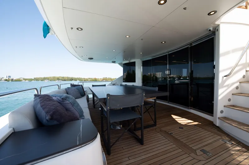 Slide: The Image of Luxurious Sunseeker 34 Metre Yacht 2010, featuring elegant outdoor seating and dining area. - 58