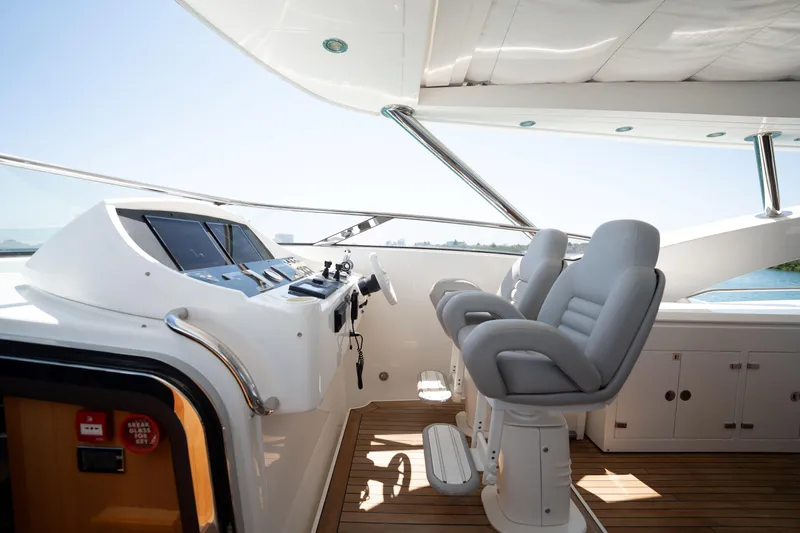 Slide: The Image of Luxurious helm of 2010 Sunseeker 34 Metre Yacht with modern controls and seating. - 59