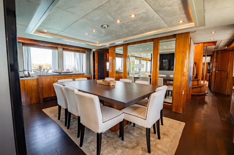 Slide: The Image of Luxurious dining area on a 2010 Sunseeker 34 Metre Yacht with elegant wood finishes. - 61