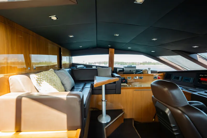 Slide: The Image of Luxurious interior of 2010 Sunseeker 34 Metre Yacht with leather seating and modern controls. - 64