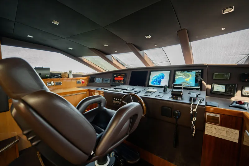 Slide: The Image of Cockpit of 2010 Sunseeker 34 Metre Yacht with navigation screens and controls. - 65