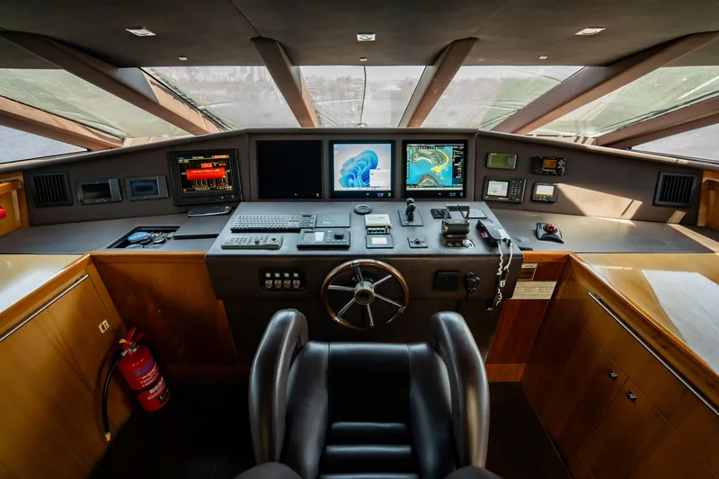 Slide: The Image of Cockpit of 2010 Sunseeker 34 Metre Yacht with navigation screens and controls. - 66