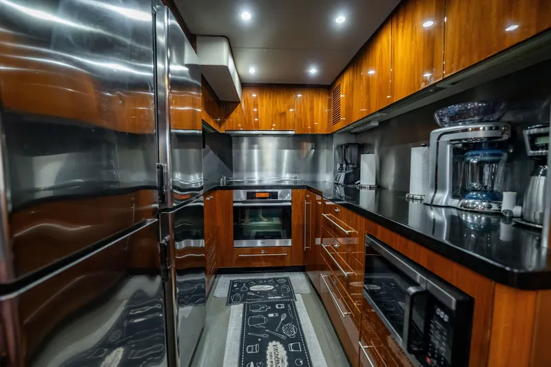 Slide: The Image of Luxurious kitchen interior on a 2010 Sunseeker 34 Metre Yacht, featuring modern appliances and sleek cabinetry. - 73