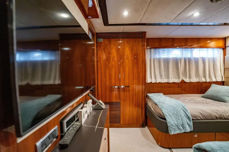 Slide: The Image of Luxurious cabin interior of a 2010 Sunseeker 34 Metre Yacht with elegant wood finishes. - 74