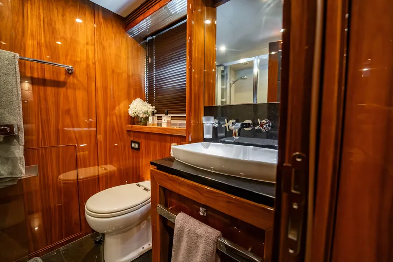 Slide: The Image of Luxurious bathroom on 2010 Sunseeker 34 Metre Yacht with wood paneling and modern fixtures. - 76