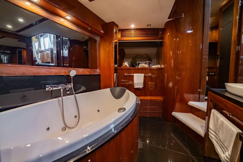 Slide: The Image of Luxurious bathroom interior on a 2010 Sunseeker 34 Metre Yacht with elegant wood finishes. - 78