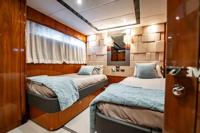 Slide: The Image of Luxurious twin bedroom on 2010 Sunseeker 34 Metre Yacht with elegant wood paneling. - 79