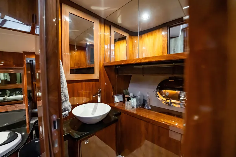 Slide: The Image of Luxurious bathroom interior on a 2010 Sunseeker 34 Metre Yacht with elegant wood finishes. - 80