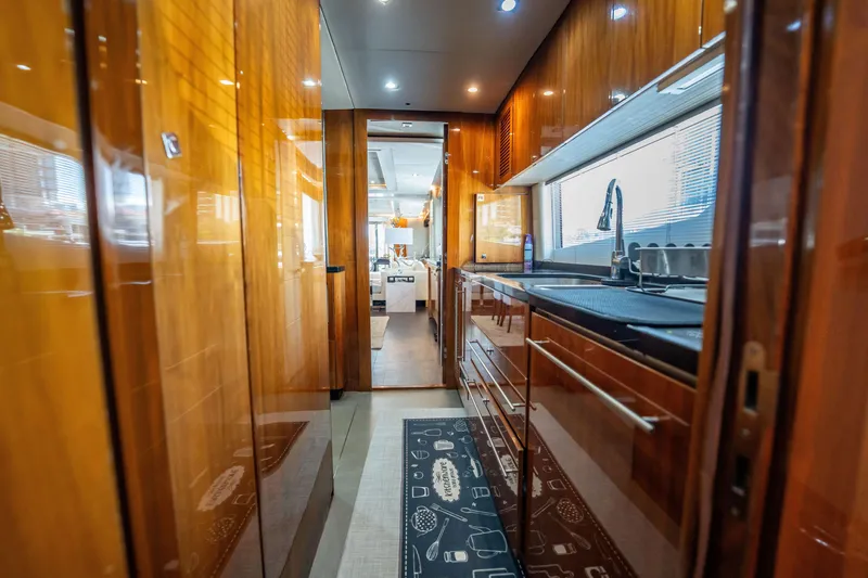 Slide: The Image of Luxurious kitchen interior of 2010 Sunseeker 34 Metre Yacht with sleek wood finishes. - 82