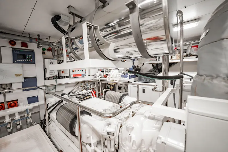 Slide: The Image of Engine room of a 2010 Sunseeker 34 Metre Yacht, featuring advanced machinery and controls. - 84