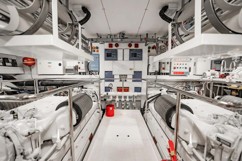 Slide: The Image of Engine room of a 2010 Sunseeker 34 Metre Yacht, showcasing advanced machinery and controls. - 88