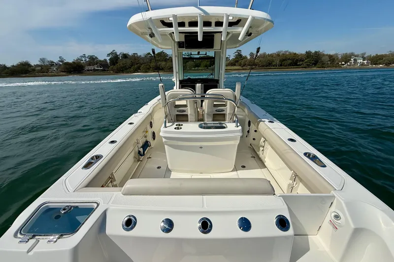 Slide: The Image of 2024 Boston Whaler 250 Outrage boat interior, featuring spacious seating and fishing amenities. - 17