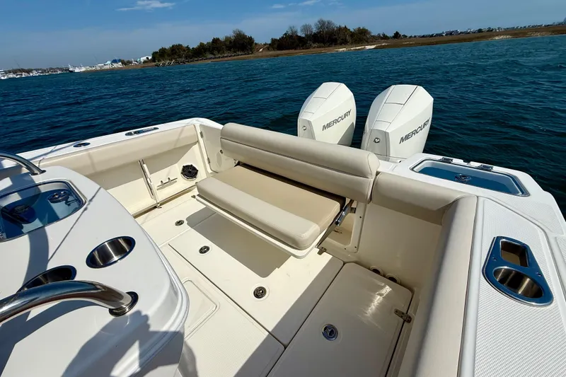 Slide: The Image of 2024 Boston Whaler 250 Outrage boat interior with dual Mercury engines. - 20