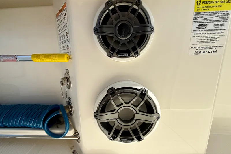 Slide: The Image of 2024 Boston Whaler 250 Outrage speakers and safety label detail. - 36