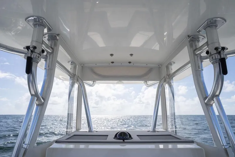 Slide: The Image of 2013 Contender 32 ST boat interior with ocean view, featuring sturdy metal supports. - 27