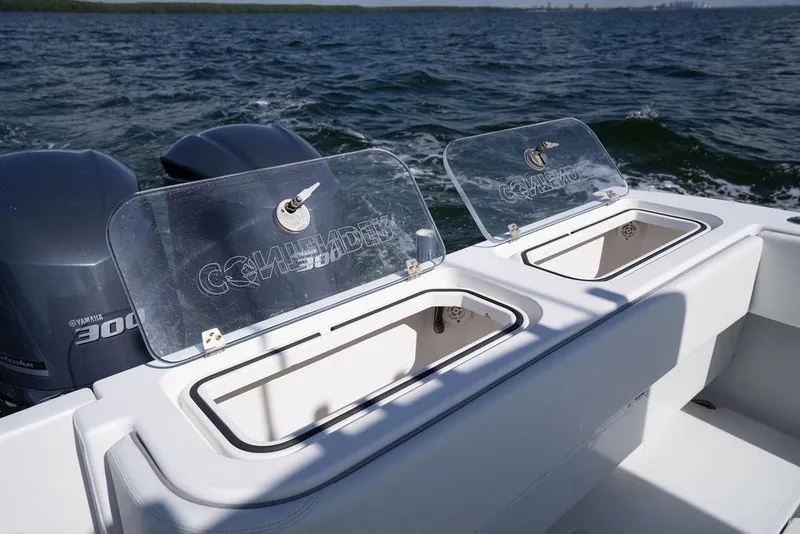 Slide: The Image of 2013 Contender 32 ST boat with Yamaha 300 engines on open water. - 32