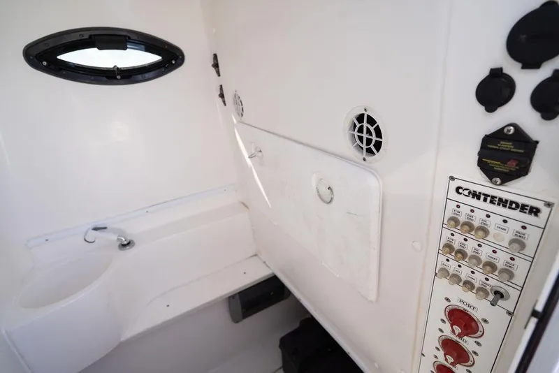 Slide: The Image of 2013 Contender 32 ST boat interior with control panel and sink. - 34