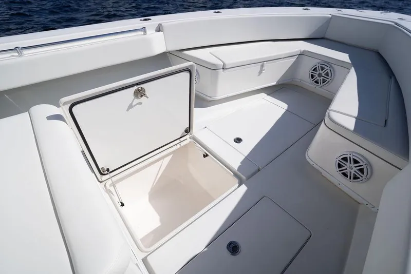 Slide: The Image of 2013 Contender 32 ST boat interior with open storage compartment and seating. - 41
