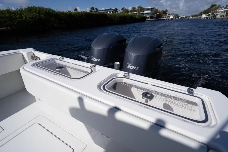 Slide: The Image of 2013 Contender 32 ST boat with dual Yamaha 300 engines on a scenic waterway. - 44