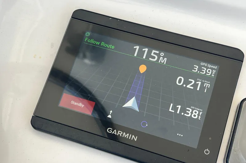 Slide: The Image of Garmin GPS display on 2013 Contender 32 ST boat showing navigation route. - 51