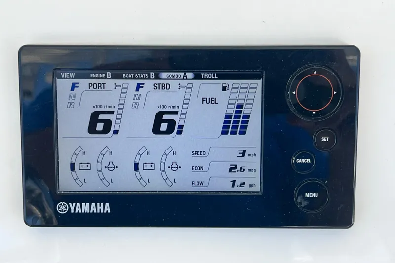 Slide: The Image of Yamaha engine display on 2013 Contender 32 ST, showing RPM, fuel, and speed metrics. - 52