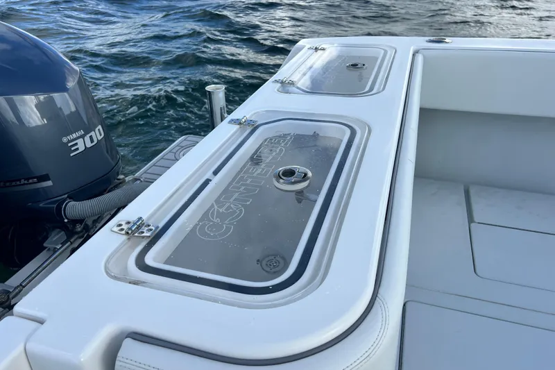 Slide: The Image of 2013 Contender 32 ST boat with Yamaha 300 engine on water. - 57