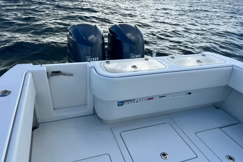 Slide: The Image of 2013 Contender 32 ST boat with twin Yamaha 300 engines on open water. - 61