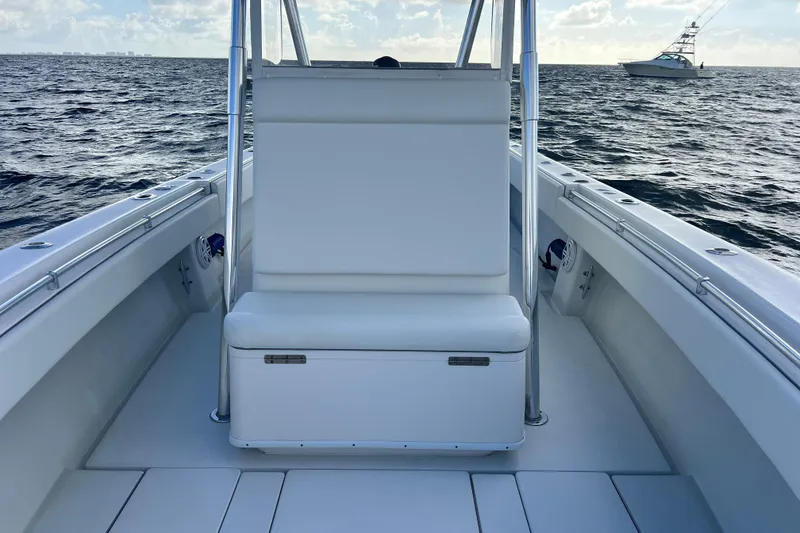 Slide: The Image of 2013 Contender 32 ST boat interior with seating, on open water. - 63