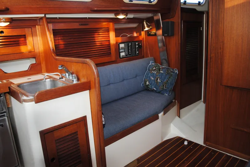 Slide: The Image of Interior of a 1988 Tartan 28 yacht with kitchen. - 28