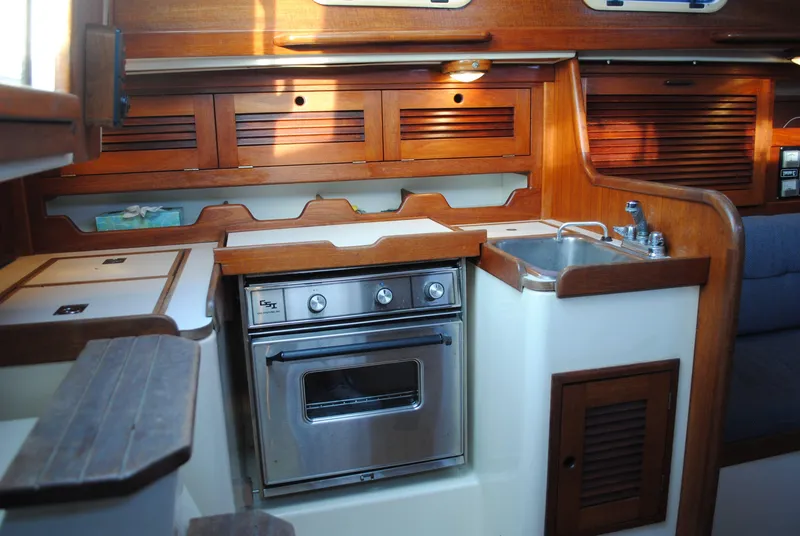 Slide: The Image of Interior of a 1988 Tartan 28 sailboat with wooden finish. - 29