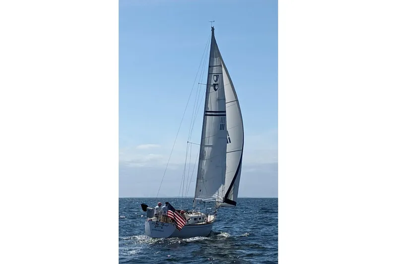 Slide: The Image of Sailing on open water, 1988 Tartan 28 yacht with American flag. - 39