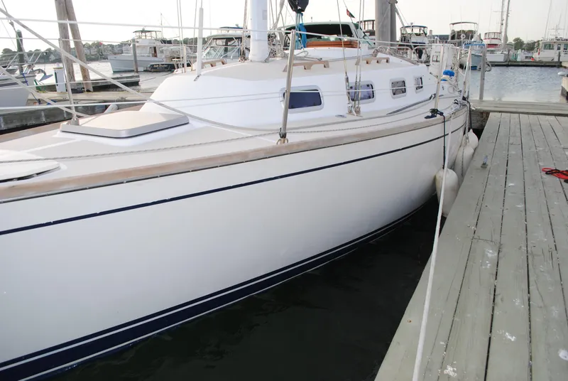 Slide: The Image of 1988 Tartan 28 sailboat docked at marina. - 6