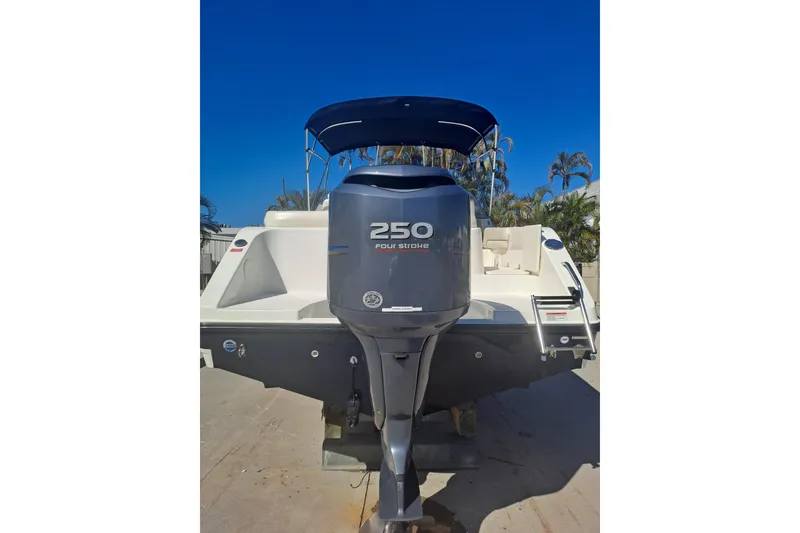 Slide: The Image of 2008 Century 2350 Dual Console boat with 250 horsepower outboard motor, rear view. - 5