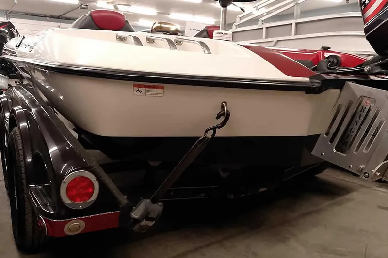 Slide: The Image of 2005 Ranger Z20 Comanche boat on trailer in garage setting. - 10