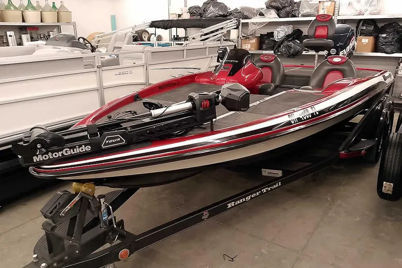Slide: The Image of 2005 Ranger Z20 Comanche boat in a garage. - 12