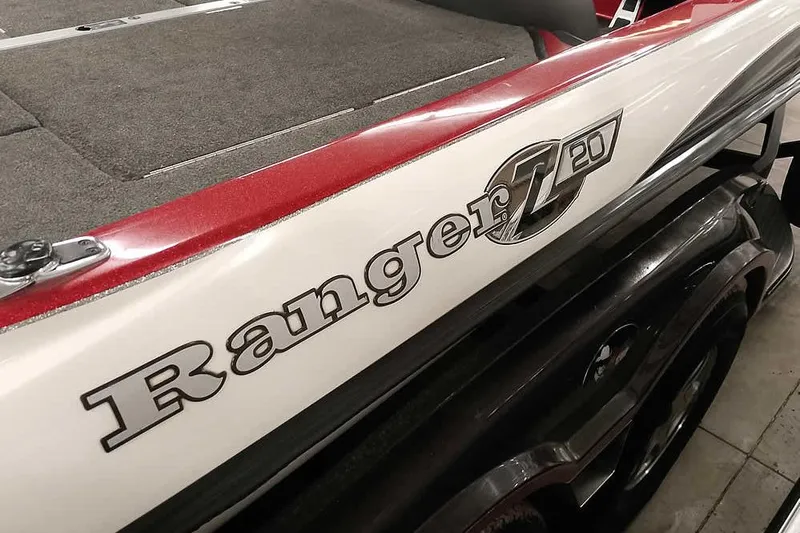 Slide: The Image of 2005 Ranger Z20 Comanche boat, red and white exterior, close-up view. - 13