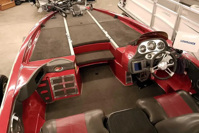 Slide: The Image of 2005 Ranger Z20 Comanche boat interior with steering wheel and control panel. - 15