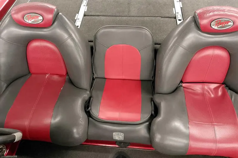 Slide: The Image of Red and gray seats of a 2005 Ranger Z20 Comanche boat interior. - 26