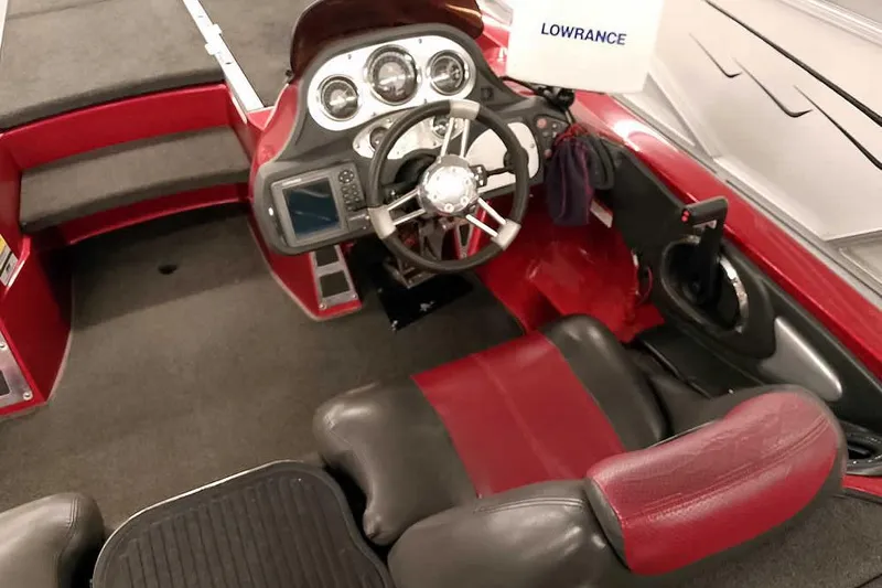 Slide: The Image of 2005 Ranger Z20 Comanche boat interior with steering wheel and Lowrance electronics. - 28