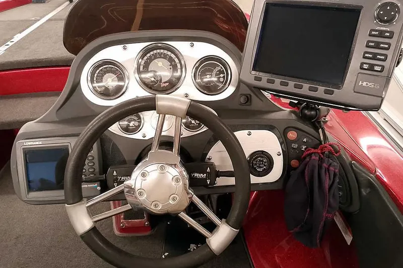 Slide: The Image of 2005 Ranger Z20 Comanche boat dashboard with steering wheel and electronic displays. - 29