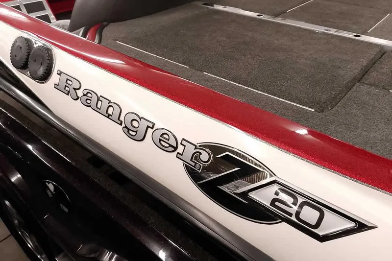 Slide: The Image of 2005 Ranger Z20 Comanche boat, red and white detailing, close-up view. - 3