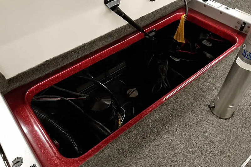 Slide: The Image of Open storage compartment in 2005 Ranger Z20 Comanche boat, showing wiring and components. - 39