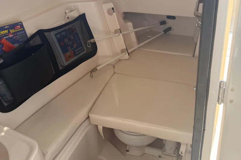 Slide: The Image of 2021 Grady-White Freedom 307 cabin interior with seating and storage compartments. - 12