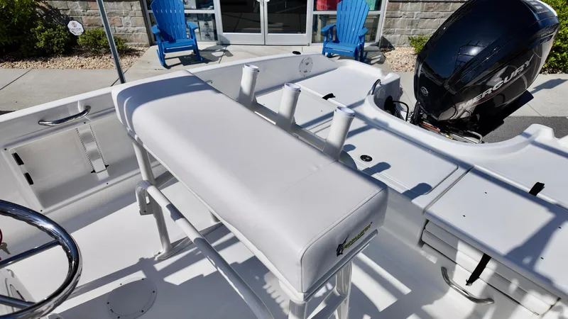 Slide: The Image of 2025 Bayliner T18 Limited Edition boat interior with seating and motor. - 11