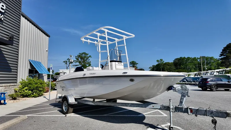 Slide: The Image of 2025 Bayliner T18 Limited Edition boat on trailer in parking lot, sunny day. - 17