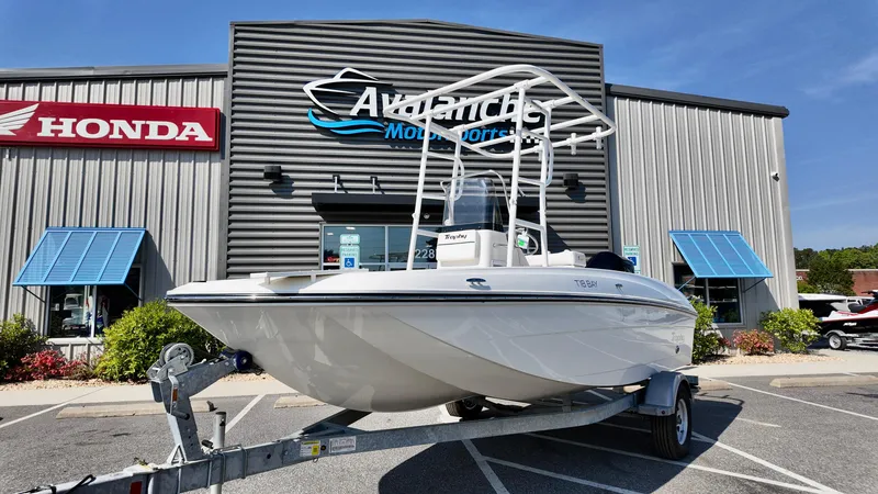 Slide: The Image of 2025 Bayliner T18 Limited Edition boat on trailer at Avalanche Motorsports dealership. - 18