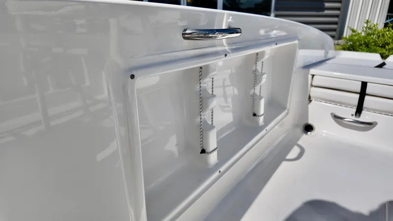 Slide: The Image of 2025 Bayliner T18 Limited Edition boat interior detail with storage compartment. - 2