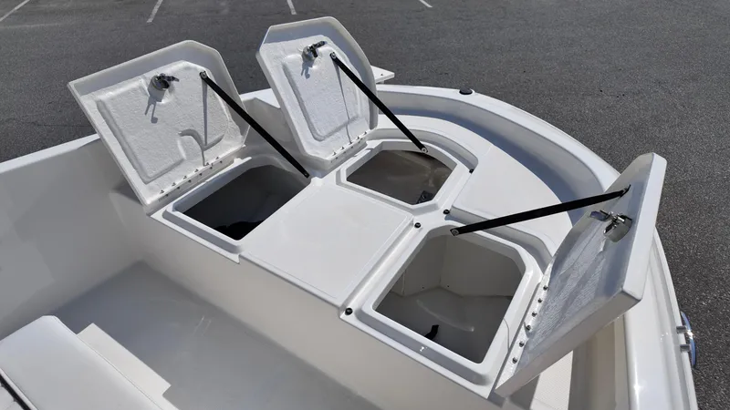 Slide: The Image of 2025 Bayliner T18 Limited Edition boat storage compartments open on deck. - 4