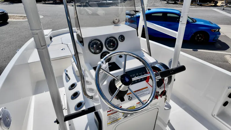 Slide: The Image of 2025 Bayliner T18 Limited Edition boat interior with steering wheel and dashboard controls. - 7